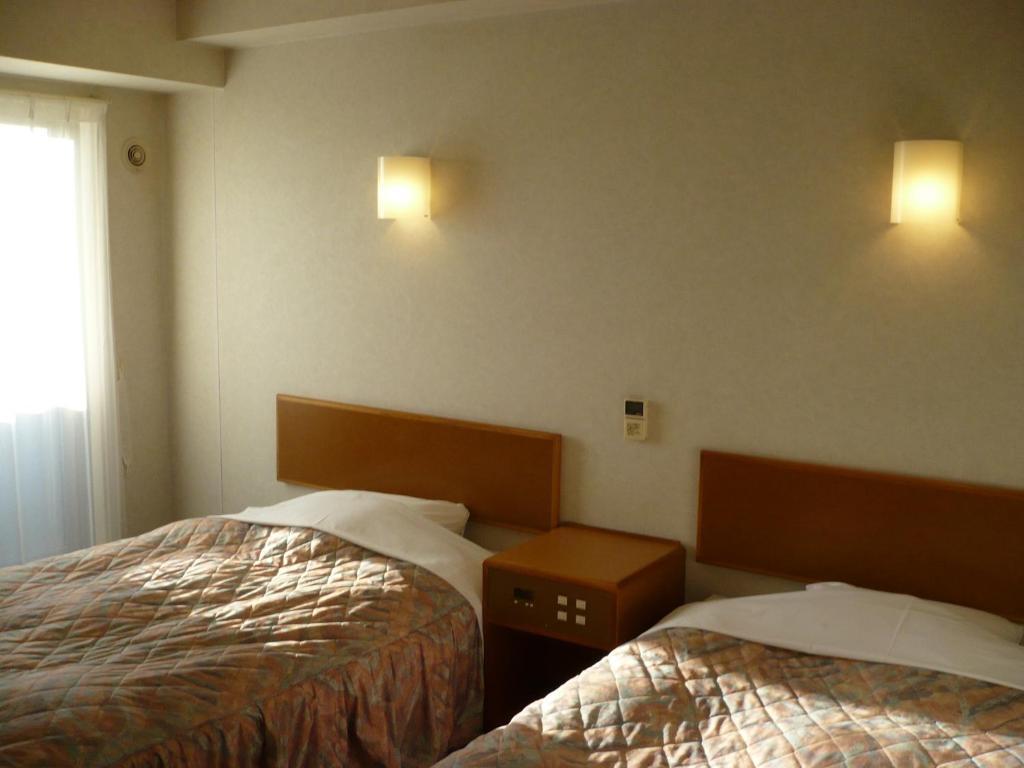 Hotel New Budget Muroran Quarto foto